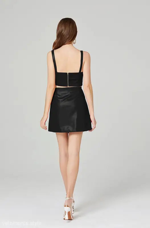 Elegant leather set featuring a zipper hip skirt and leather chest wrap for summer style