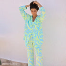 Woman in patterned elegant long sleeve silk pajamas from Elegant Long Sleeve Satin Printed Lounge Set Silk Pajamas