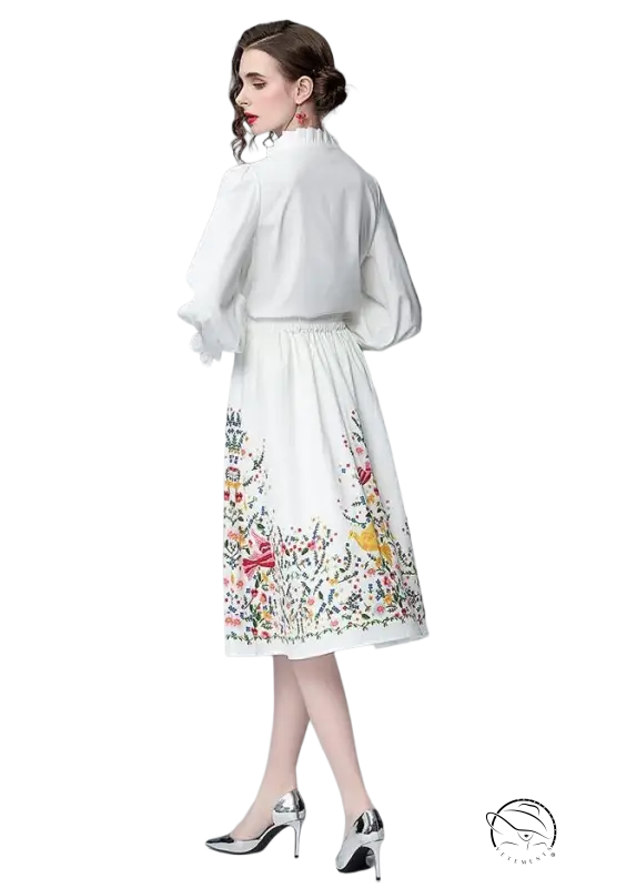 Elegant woman in white floral long sleeve two piece countryside dress