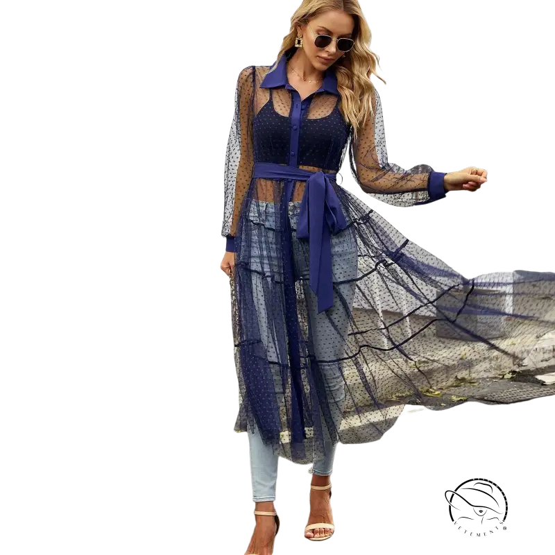 Woman in sheer polka dot summer mesh dress wearing elegant long sleeve waist dress