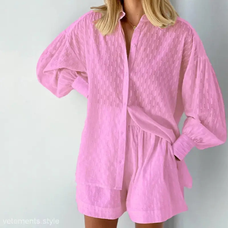Pink two-piece shorts set featuring elegant design for a stylish office suit look