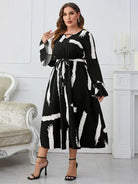 Elegant Neckline Flared Dress with Graffiti Cutout and Belted V-neck