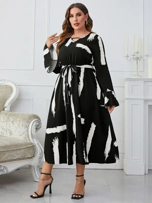 Elegant Neckline Flared Dress with Graffiti Cutout and Belted V-neck
