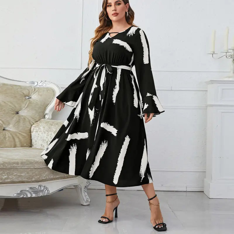 Elegant Neckline Flared Dress with Graffiti Cutout and Belted V-neck