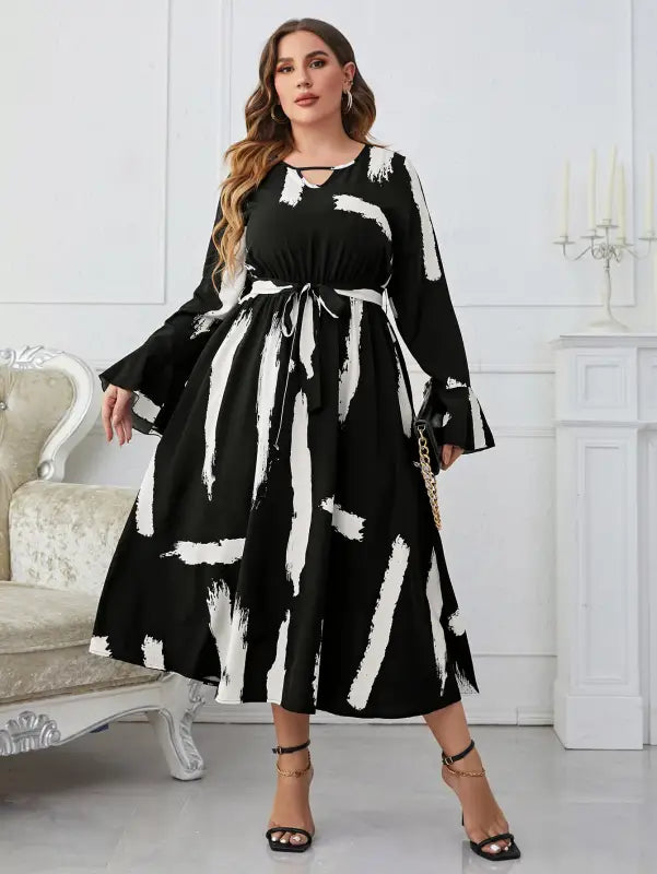 Elegant Neckline Flared Dress with Graffiti Cutout and Belted V-neck