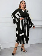Elegant Neckline Flared Dress with Graffiti Cutout and Belted V-neck