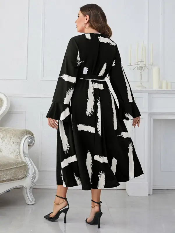 Elegant Neckline Flared Dress with Graffiti Cutout and Belted V-neck