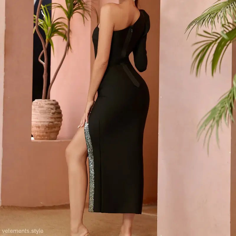Black one-shoulder evening dress featuring a high side slit and sequin trim