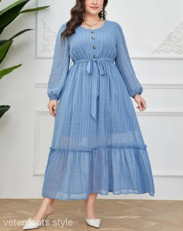 Elegant Sky Dress featuring a blue long-sleeved maxi dress with lace details