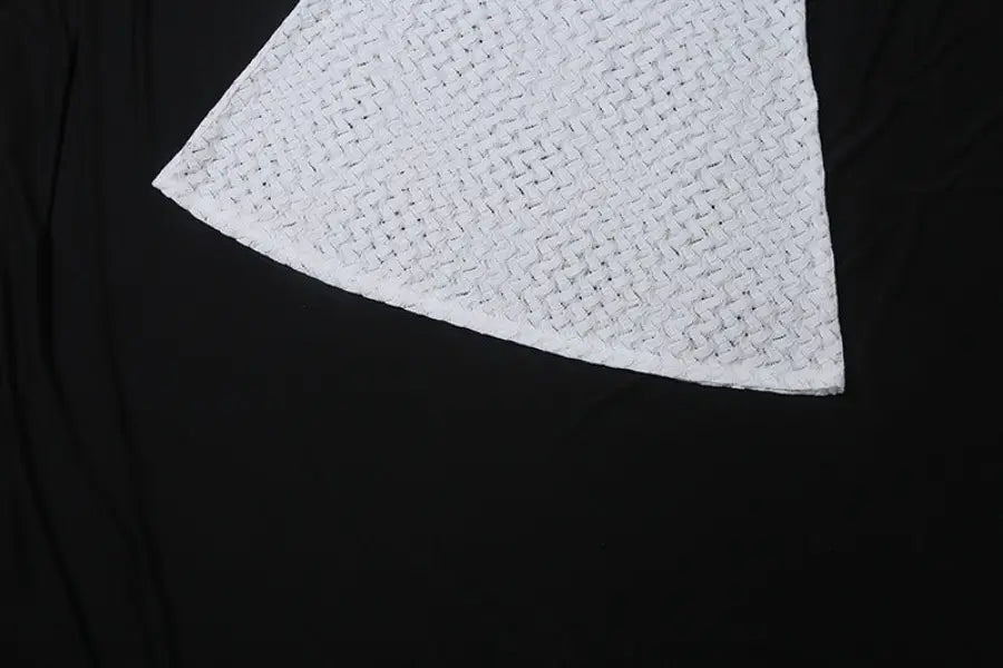 White crocheted triangular cloth of an elegant slim fit evening dress with backless design