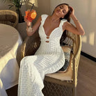 Elegant Slim Fit Evening Dress displayed in white textured fabric with backless V-neck design