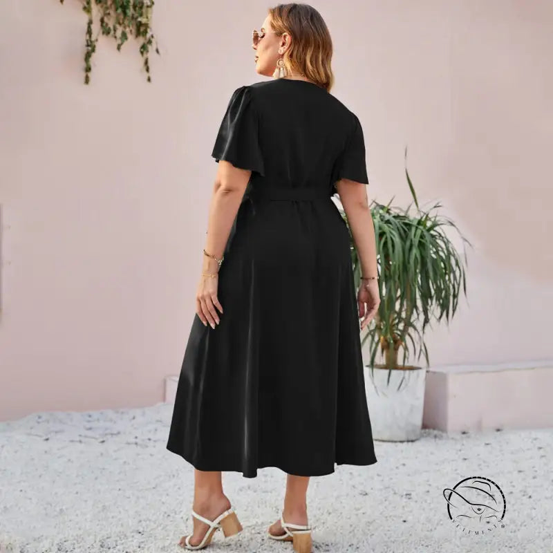 Woman in elegant slit lace slim dress with ruffles and butterfly sleeves