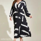 Black and white pleated Elegant Tala Dress with long sleeves and abstract pattern