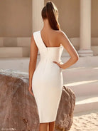 Woman models an elegant white dress with one shoulder sleeve, perfect for any occasion