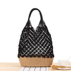 Woven handbag featuring a black crochet top and tan wicker bottom for handmade elegance