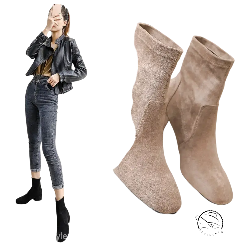 Pair of beige suede ankle boots with block heels and apricot colored velvet