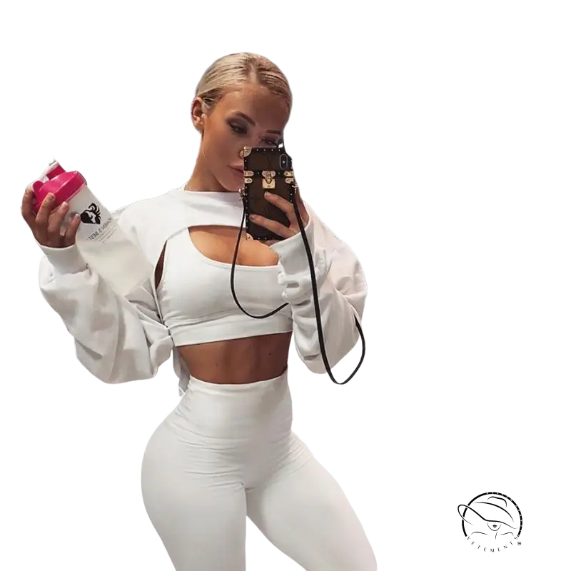 Woman in fashionable fringes sweater takes gym selfie with pink water bottle