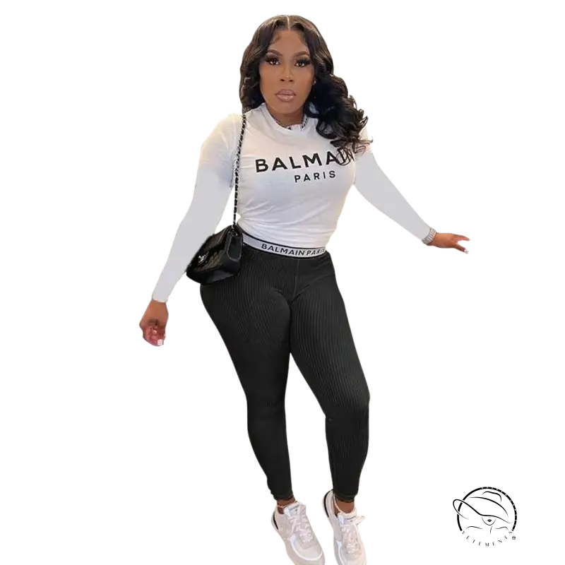 Woman in floral unique two piece set: slim long sleeve top and pants