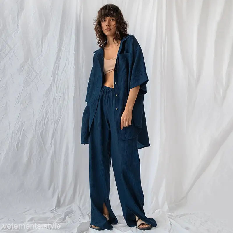 Woman in navy blue french cotton comfortable pajamas set with beige crop top for spring lounging