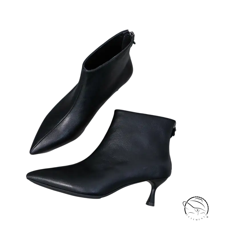 Stylish black leather short boots with pointed toe and high heel for winter