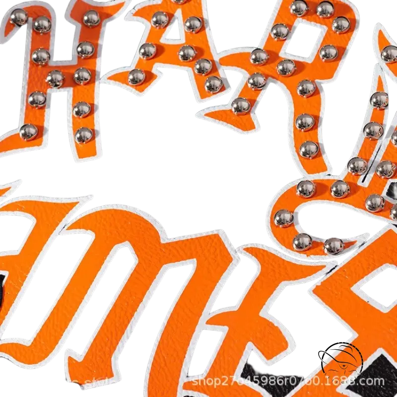 Black leather jacket with orange studded lettering, graffiti printing motorcycle style
