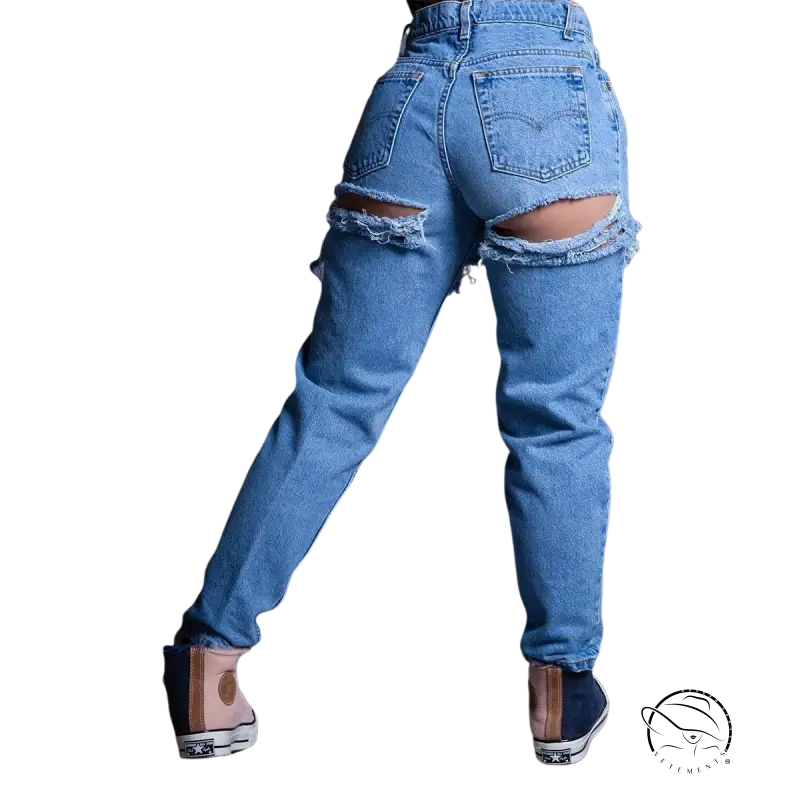 High waist loose jeans with rips exposing thigh skin