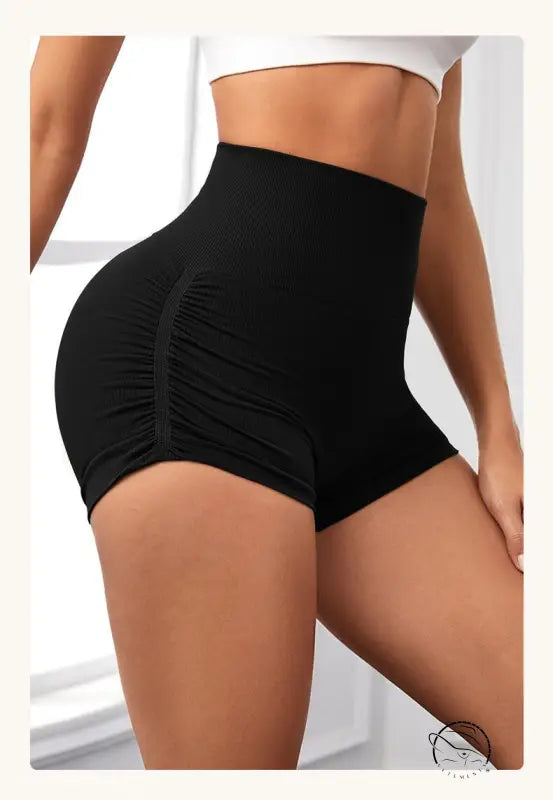 Black high-waisted peach hip fitness pants with ruched design