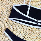 Black bikini top with white trim, adjustable straps, part of High Waist Sexy Bikini collection