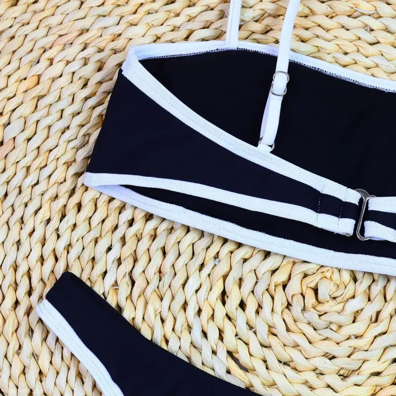 Black bikini top with white trim, adjustable straps, part of High Waist Sexy Bikini collection