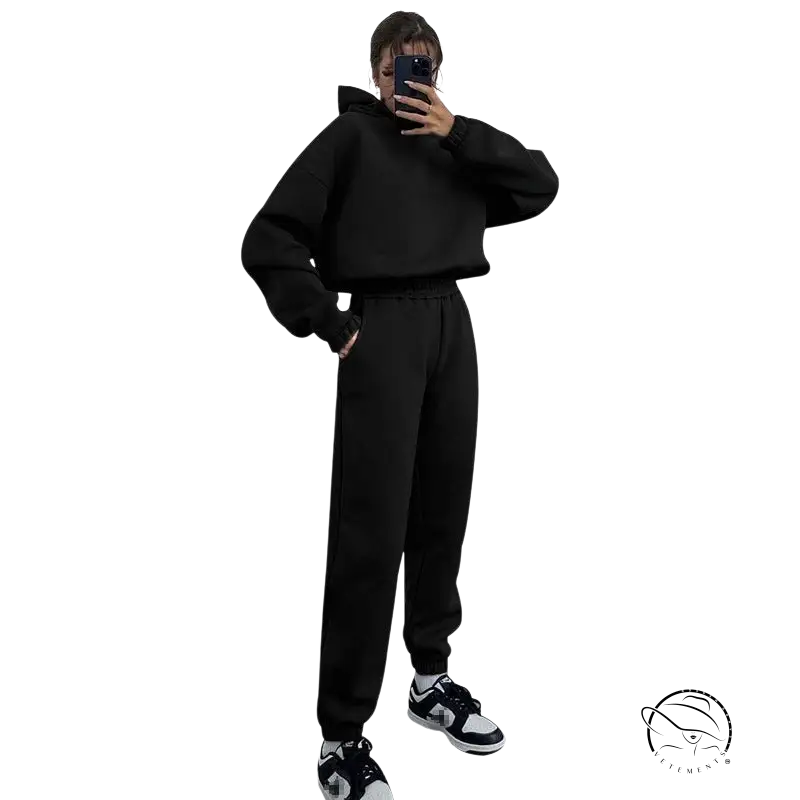 Person in hooded long sleeve sweater taking winter hooded casual mirror selfie