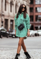 Green and white checkered oversized shirt dress styled as a casual coat for outings