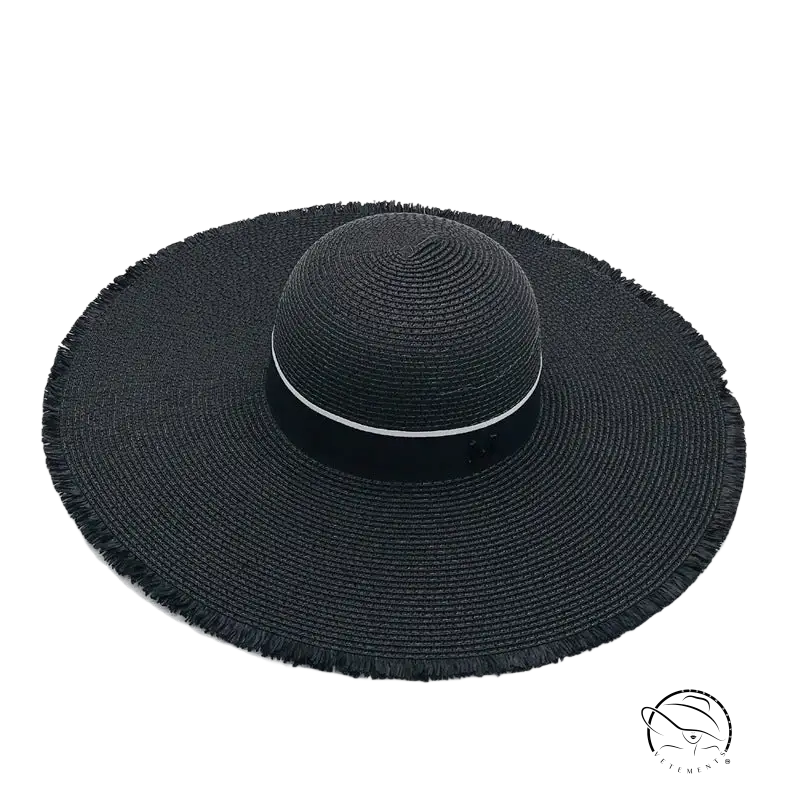 Lack of Color wide-brim sun hat with black straw and beige ribbon band