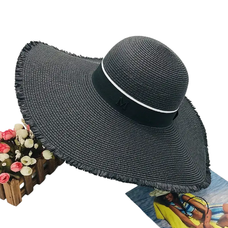 Lack of Color wide-brim sun hat with black straw braid broad brim and beige ribbon band