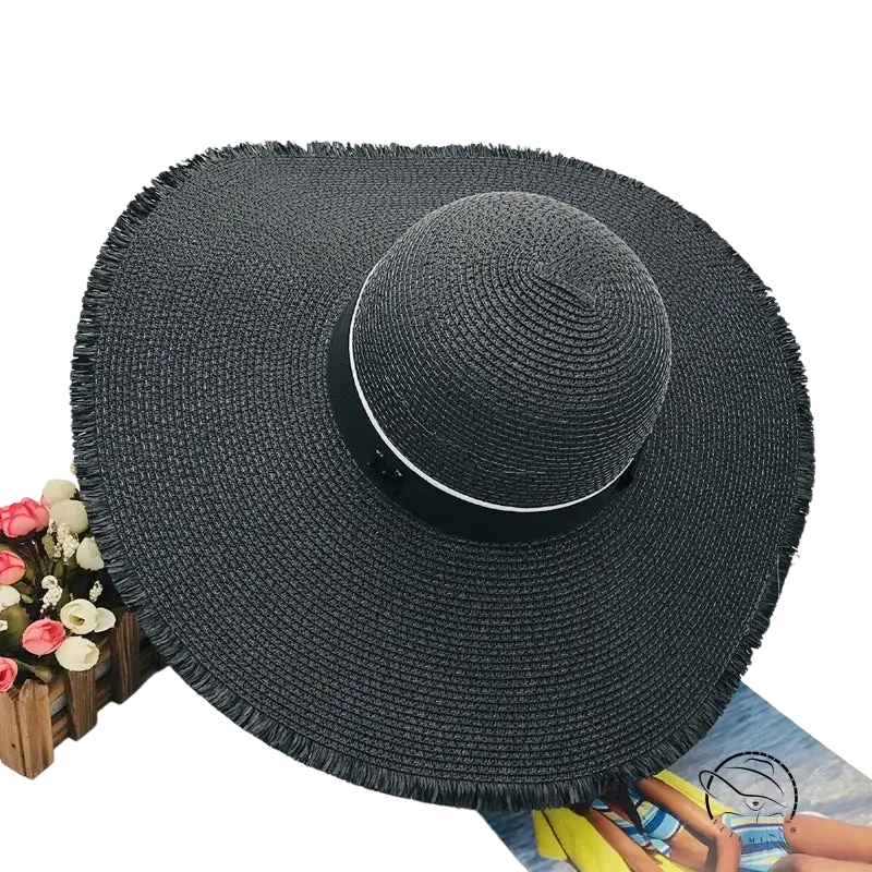 Lack of Color wide-brim sun hat with black woven straw and beige ribbon band