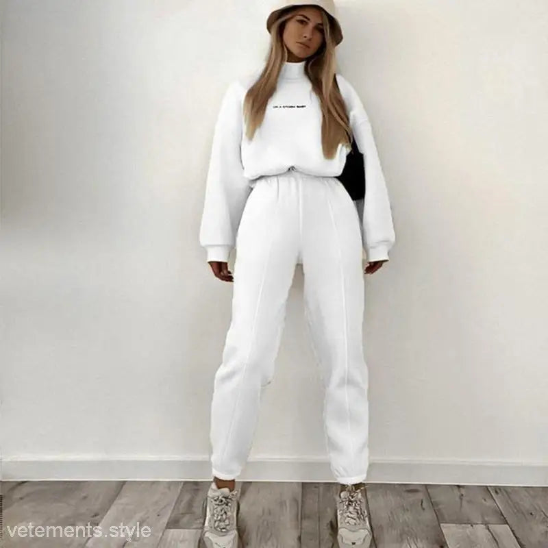White sweat suit with bucket hat showcasing Lanna Alphabet Outfit winter casual sweatshirt