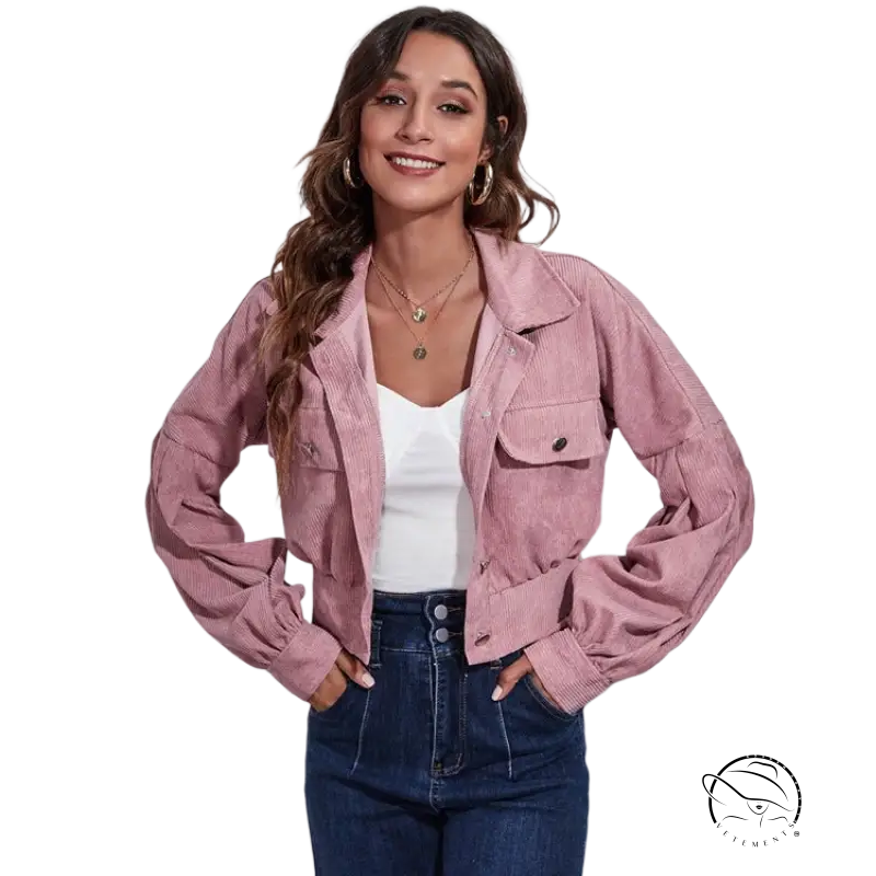 Pink lantern sleeve corduroy jacket over white top and blue jeans