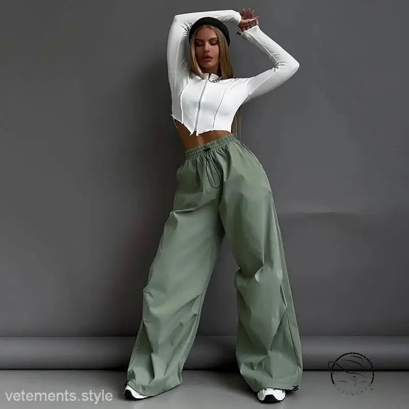 Woman in white crop top and light gray casual cute trousers