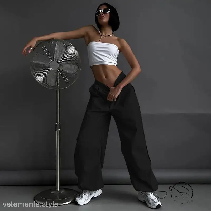 Woman in white tube top and light gray casual cute trousers