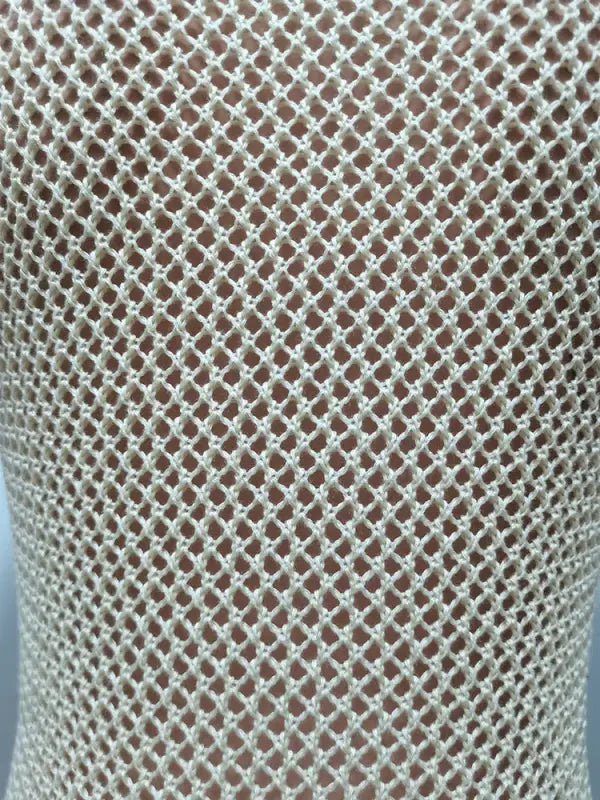 Beige crocheted fishnet garment from Knitted Beach Dress with Elegant Fringe Detail