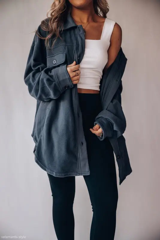 Woman wearing a long sleeve warm shacket coat, ideal for winter women clothing