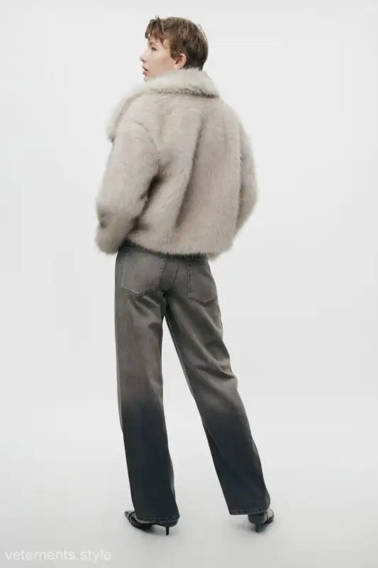 Woman in a fur jacket and ombre jeans showcasing a Loose Padded Urban Jacket