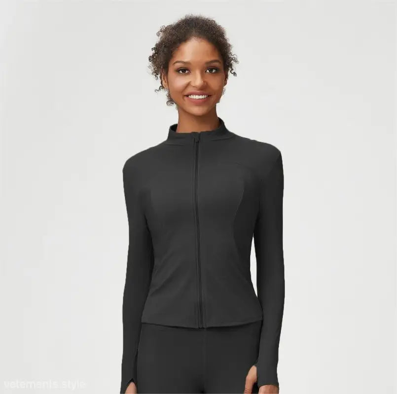 Black athletic jacket from the Matcha Green Long Sleeve Coat with tight waist design