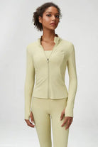 Woman in Matcha Green Long Sleeve Coat with Tight Waist for yoga and athletic pursuits