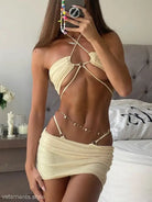Cream-colored halter top and mini skirt set from Ocean Elegance Bikini for sexy swimwear dress style