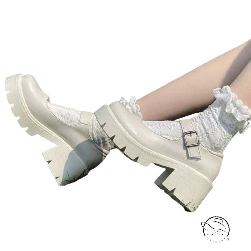 Cream-colored buckle platform heels with lace-up and silver buckle