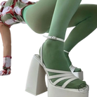 Elegant ankle strap heel with white platforms, strappy details, and mint green tights