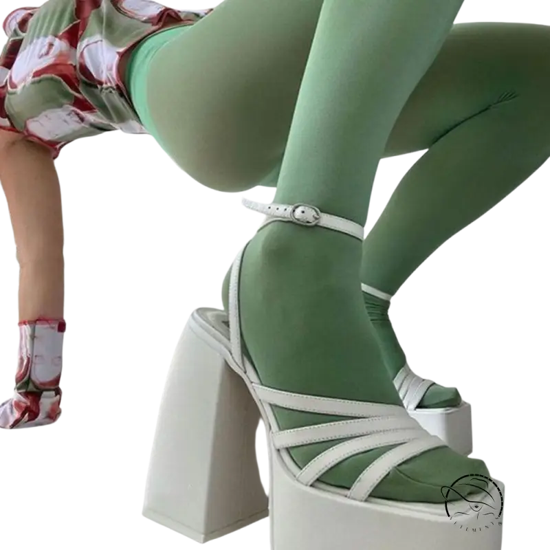 Elegant ankle strap heel with white platforms, strappy details, and mint green tights