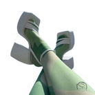 Mint green legs in elegant ankle strap high heel sandals