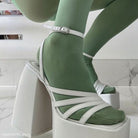 White platform ankle strap heel styled with mint green socks and a strappy design