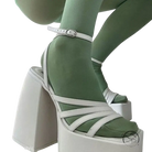 White ankle strap heel with strappy design and mint green socks